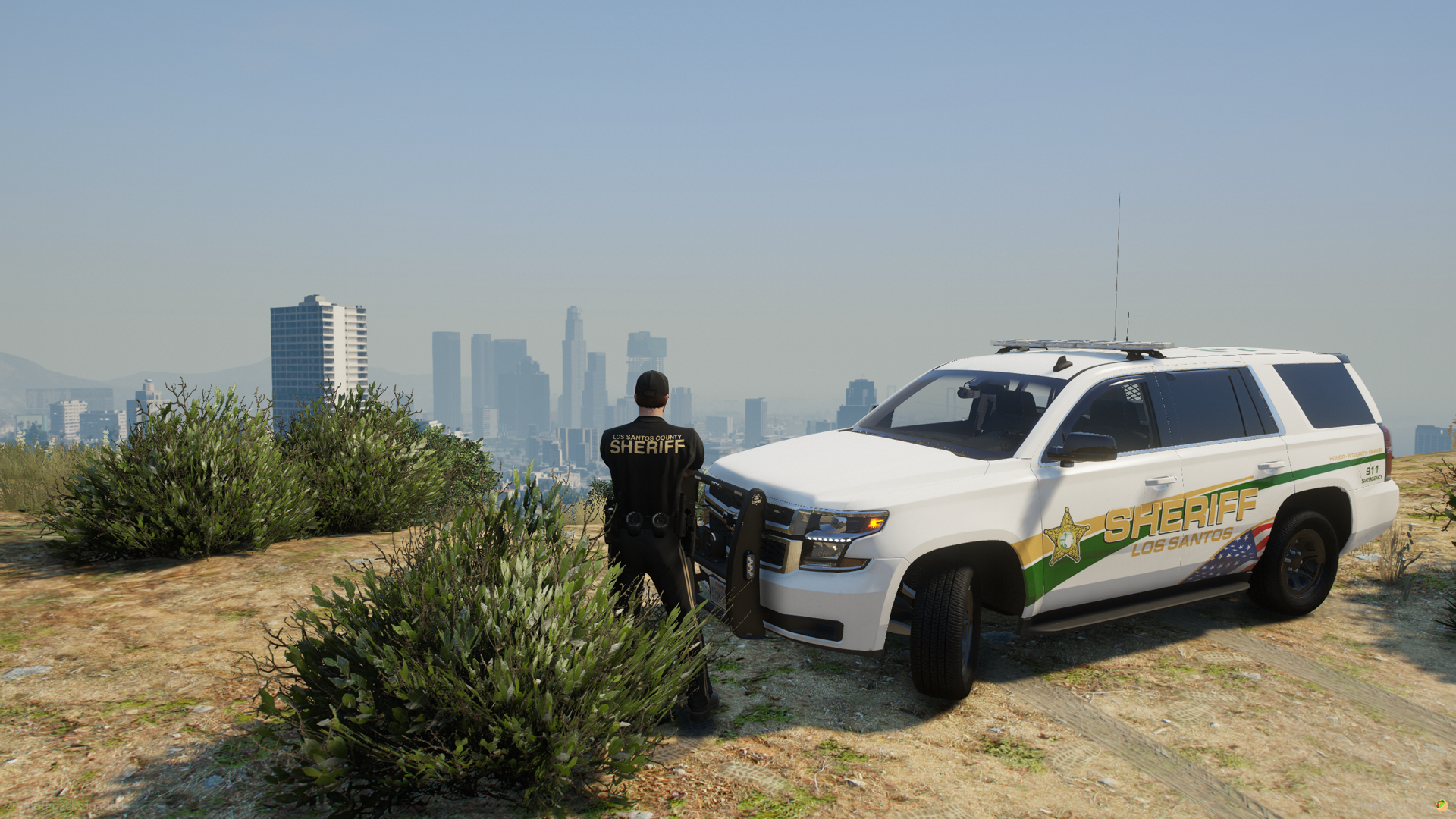 A sheriff surveys the Los Santos skyline from above.